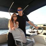 Torben and Alicia pose for a photo on their boat.